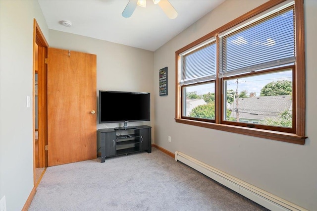 37 Swan Ln, Levittown, NY 11756 - living room with a baseboard heating unit, healthy amount of natural light, carpet, and a ceiling fan
