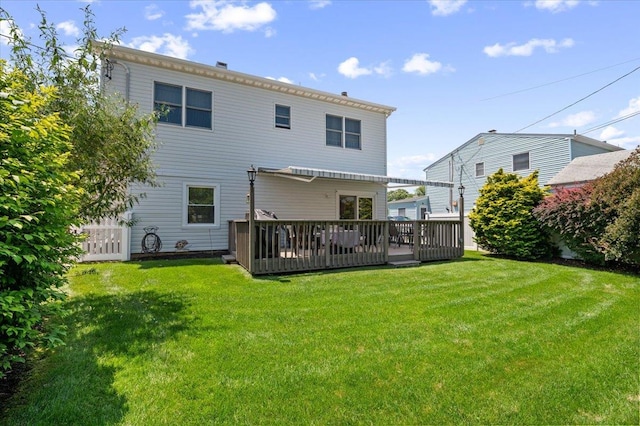 37 Swan Ln, Levittown, NY 11756 - back of house featuring a deck and a lawn