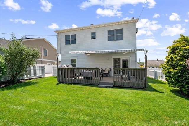 37 Swan Ln, Levittown, NY 11756 - back of property featuring a fenced backyard and a deck