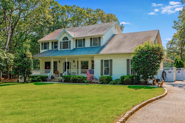 44 Croft Ln, Smithtown, NY 11787 - colonial house featuring covered porch, a front lawn, and driveway