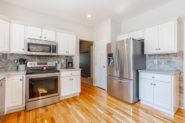44 Croft Ln, Smithtown, NY 11787 - kitchen with appliances with stainless steel finishes, white cabinetry, light countertops, and recessed lighting
