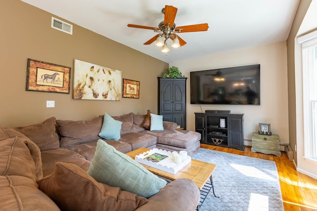 44 Croft Ln, Smithtown, NY 11787 - living room with a ceiling fan, light wood-style floors, plenty of natural light, baseboard heating, and lofted ceiling