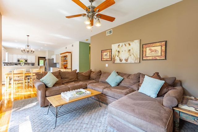 44 Croft Ln, Smithtown, NY 11787 - living room featuring a chandelier, a ceiling fan, and recessed lighting