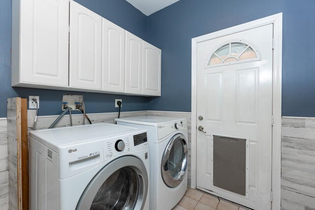 44 Croft Ln, Smithtown, NY 11787 - washroom featuring separate washer and dryer, cabinet space, wainscoting, light tile patterned flooring, and tile walls