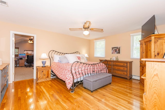 44 Croft Ln, Smithtown, NY 11787 - bedroom with light wood-style flooring, a baseboard radiator, an office area, and ceiling fan