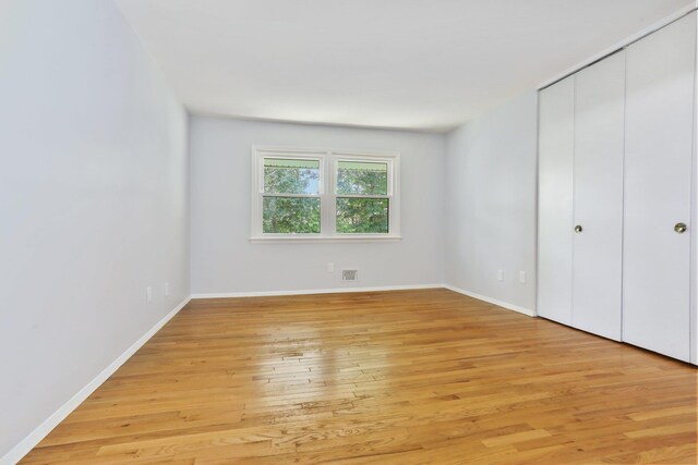 34 Warwick Pl Unit D, Yorktown Heights, NY 10598 - unfurnished bedroom with light wood-style floors, a closet, and baseboards