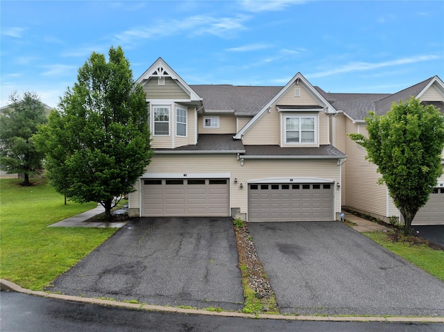 38 Woodside Knolls Dr, Middletown, NY 10940 - view of front of house with asphalt driveway, a front yard, an attached garage, and roof with shingles