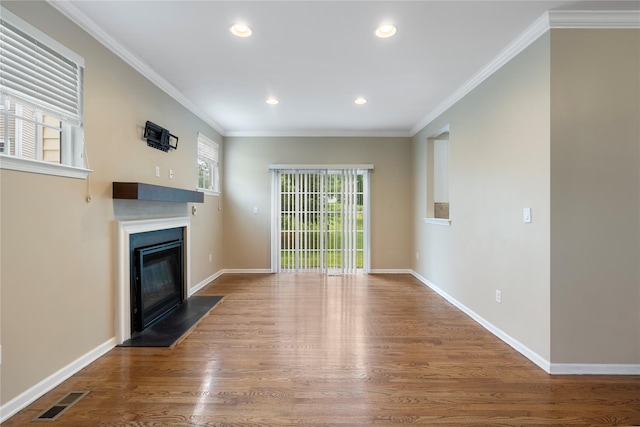 38 Woodside Knolls Dr, Middletown, NY 10940 - unfurnished living room featuring a glass covered fireplace, wood finished floors, recessed lighting, and ornamental molding