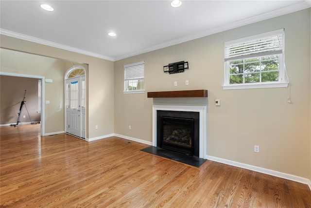 38 Woodside Knolls Dr, Middletown, NY 10940 - unfurnished living room featuring ornamental molding, light wood-style floors, a fireplace with flush hearth, and recessed lighting