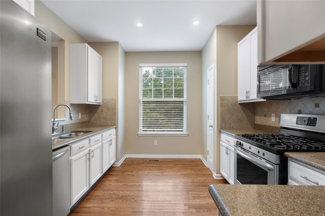 38 Woodside Knolls Dr, Middletown, NY 10940 - kitchen featuring stainless steel appliances, light wood-style floors, white cabinets, backsplash, and recessed lighting