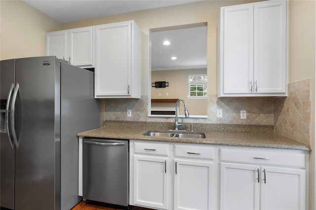 38 Woodside Knolls Dr, Middletown, NY 10940 - kitchen with stainless steel appliances, white cabinetry, backsplash, recessed lighting, and crown molding