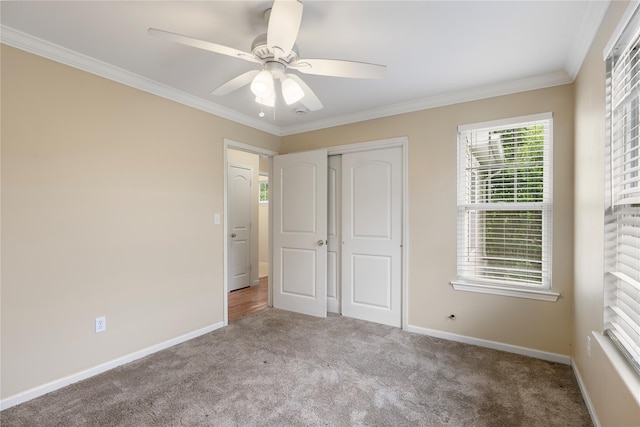 38 Woodside Knolls Dr, Middletown, NY 10940 - unfurnished bedroom with carpet, crown molding, a closet, and a ceiling fan