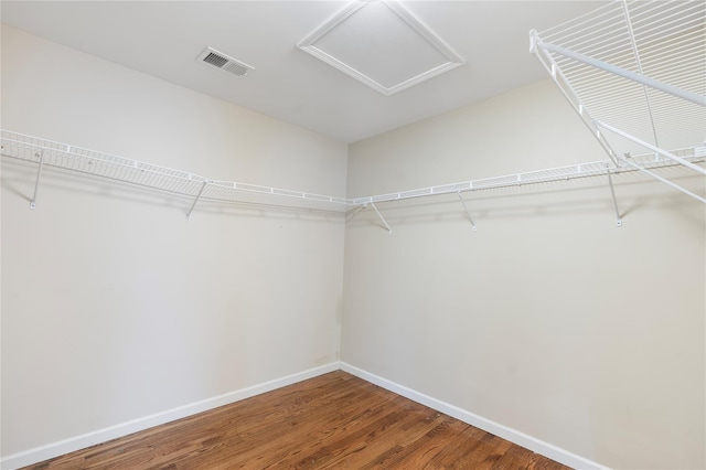 38 Woodside Knolls Dr, Middletown, NY 10940 - walk in closet featuring wood finished floors and attic access