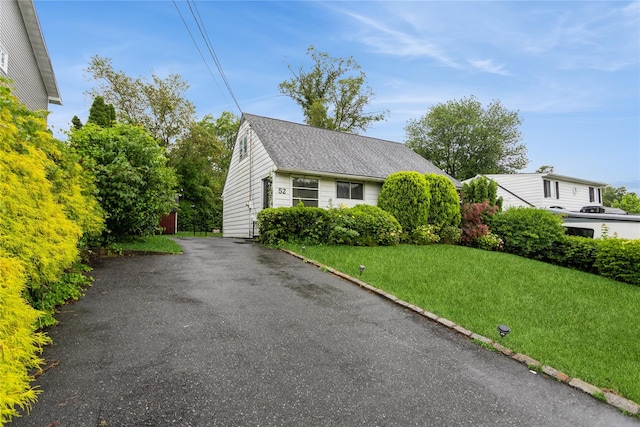 52 Newkirk Rd, Yonkers, NY 10710 - view of front of home with a front yard, a shingled roof, and asphalt driveway