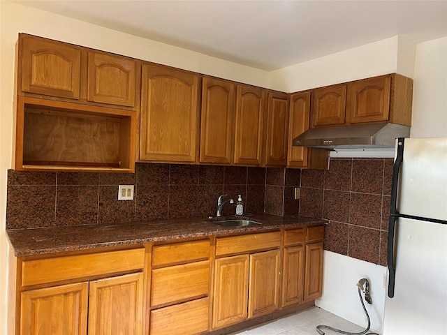 55-05 98th St, Corona, NY 11368 - kitchen featuring freestanding refrigerator, exhaust hood, dark stone countertops, and decorative backsplash