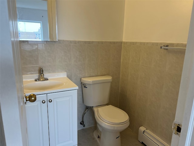 55-05 98th St, Corona, NY 11368 - bathroom with a baseboard radiator, tile walls, vanity, tile patterned floors, and wainscoting