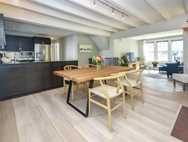 20 Oldwood Rd, Port Washington, NY 11050 - dining space with track lighting, beamed ceiling, and light wood-type flooring