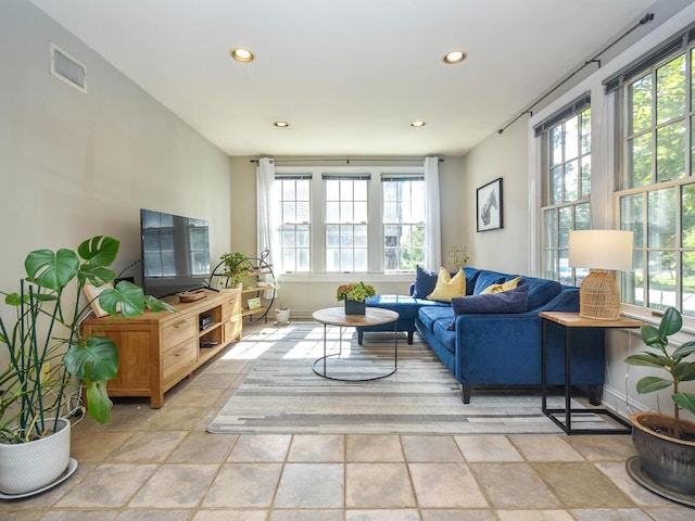 20 Oldwood Rd, Port Washington, NY 11050 - living room with plenty of natural light, recessed lighting, and light stone finish flooring