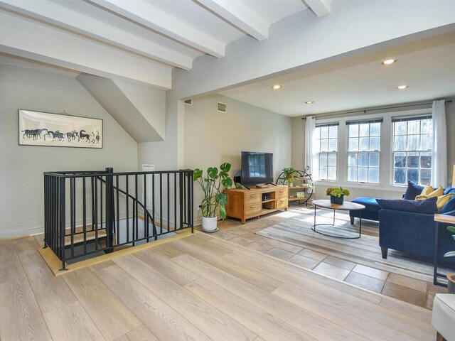 20 Oldwood Rd, Port Washington, NY 11050 - living area with wood finished floors, beam ceiling, and recessed lighting