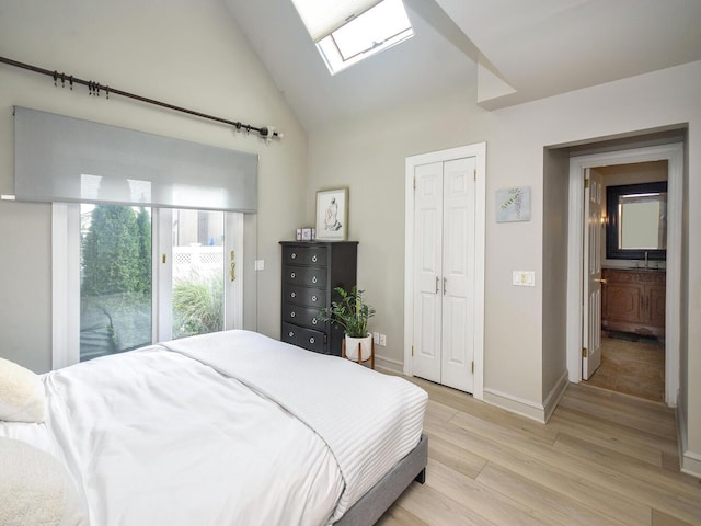 20 Oldwood Rd, Port Washington, NY 11050 - bedroom featuring a skylight, light wood-type flooring, lofted ceiling, and a closet