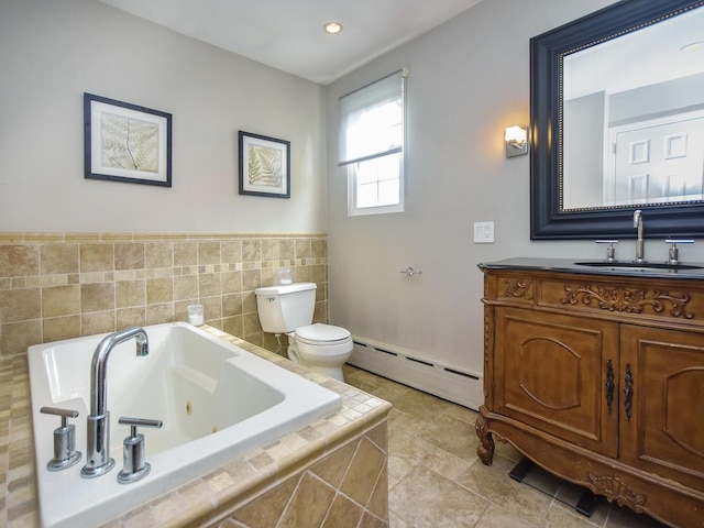 20 Oldwood Rd, Port Washington, NY 11050 - full bath with a baseboard heating unit, vanity, a whirlpool tub, tile walls, and tile patterned flooring
