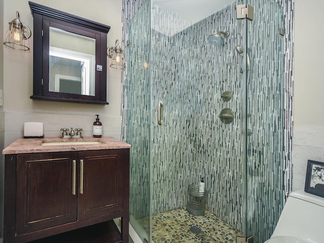 20 Oldwood Rd, Port Washington, NY 11050 - bathroom with tile walls, a stall shower, and vanity