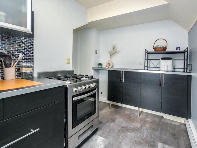 20 Oldwood Rd, Port Washington, NY 11050 - kitchen featuring gas stove, dark cabinetry, tasteful backsplash, and lofted ceiling