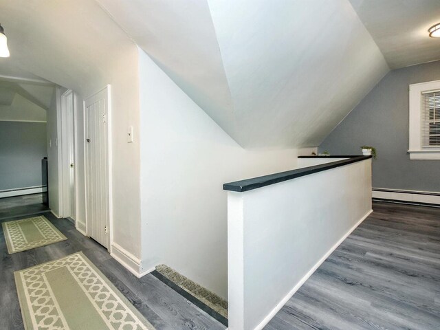 20 Oldwood Rd, Port Washington, NY 11050 - hall with lofted ceiling, a baseboard radiator, an upstairs landing, and dark wood-style floors