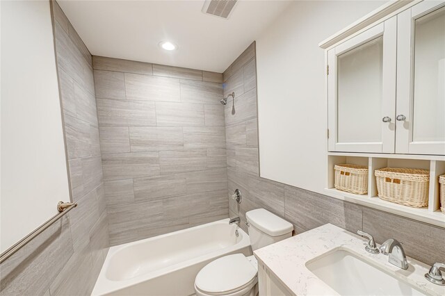1350 Islip Ave, Brentwood, NY 11717 - bathroom featuring bathtub / shower combination, vanity, tile walls, and recessed lighting