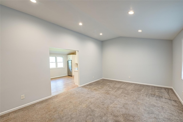 1350 Islip Ave, Brentwood, NY 11717 - spare room with light carpet, recessed lighting, and vaulted ceiling