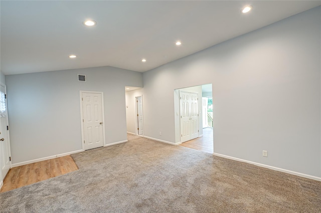 1350 Islip Ave, Brentwood, NY 11717 - empty room with light colored carpet, recessed lighting, and lofted ceiling