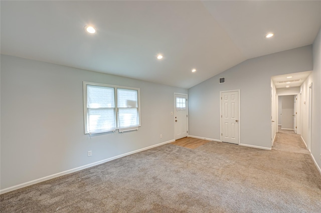 1350 Islip Ave, Brentwood, NY 11717 - entrance foyer with light colored carpet, recessed lighting, and vaulted ceiling