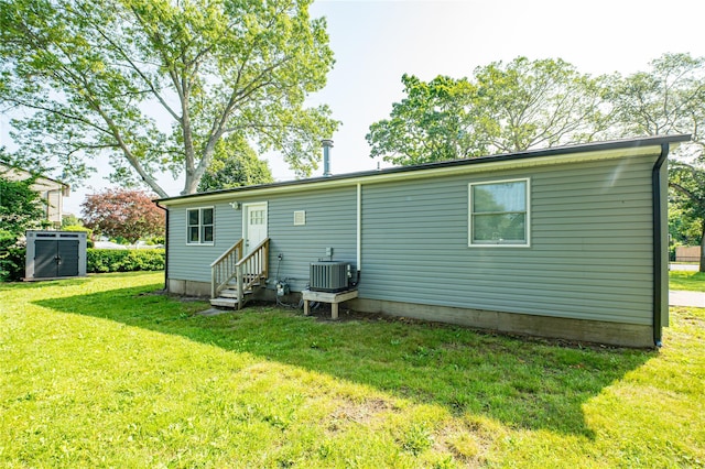 1350 Islip Ave, Brentwood, NY 11717 - rear view of house with entry steps and a yard