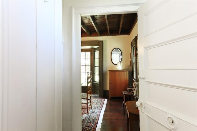 entrance foyer featuring a wooden ceiling with exposed beams and dark wood-style flooring