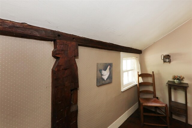 living area featuring baseboards