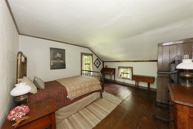 bedroom featuring wood-type flooring and lofted ceiling
