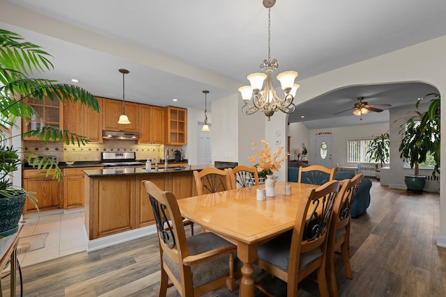 78-32 76th St, Glendale, NY 11385 - dining room featuring a ceiling fan, light wood-type flooring, recessed lighting, a chandelier, and radiator heating unit