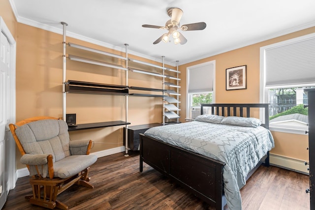 78-32 76th St, Glendale, NY 11385 - bedroom with baseboard heating, crown molding, wood finished floors, and baseboards