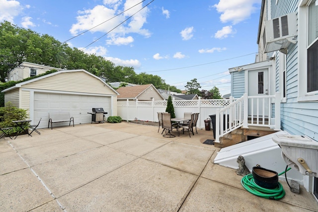 78-32 76th St, Glendale, NY 11385 - view of patio / terrace with a grill, a detached garage, outdoor dining area, an outbuilding, and cooling unit
