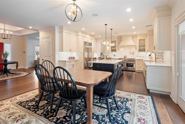 77 Crabapple Rd, Manhasset, NY 11030 - dining space with a chandelier, dark wood-style floors, ornamental molding, and recessed lighting