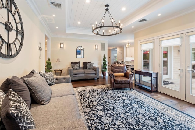 77 Crabapple Rd, Manhasset, NY 11030 - living room with wood finished floors, a chandelier, a raised ceiling, crown molding, and recessed lighting