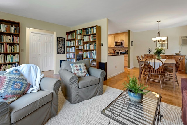 38 Sunset Dr, Brewster, NY 10509 - living area featuring a chandelier and light wood-style floors