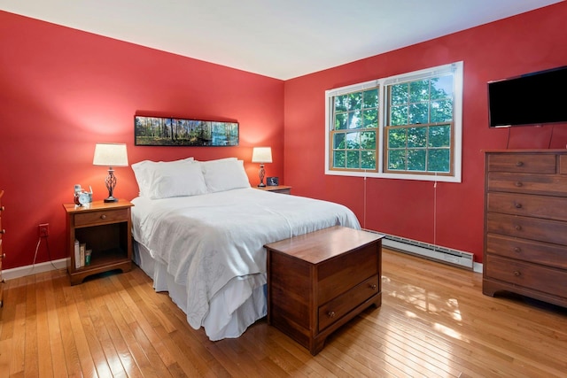 38 Sunset Dr, Brewster, NY 10509 - bedroom with a baseboard radiator and light wood-style floors