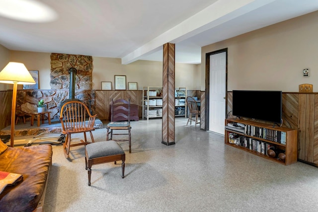 38 Sunset Dr, Brewster, NY 10509 - living room with a wood stove and a wainscoted wall