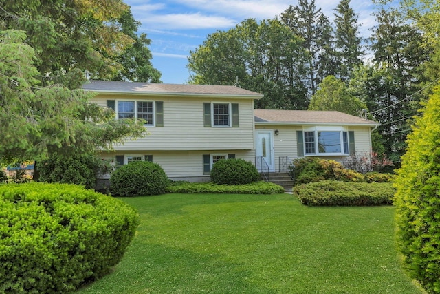 38 Sunset Dr, Brewster, NY 10509 - tri-level home featuring a front lawn
