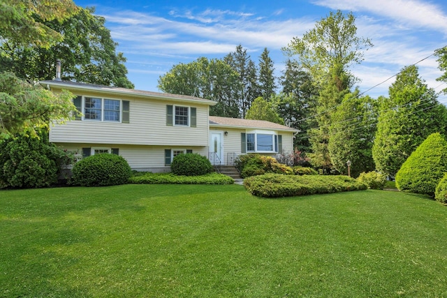 38 Sunset Dr, Brewster, NY 10509 - tri-level home featuring a front lawn