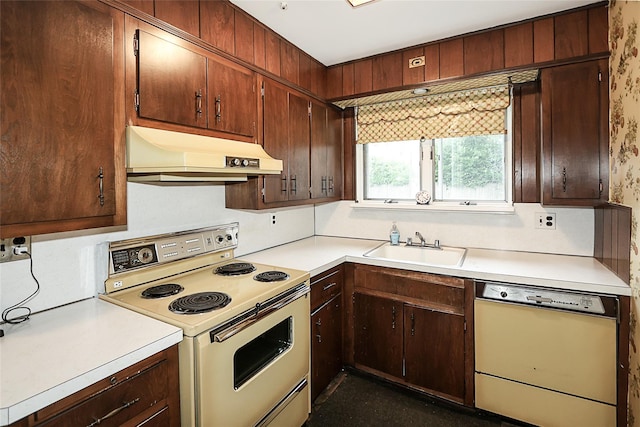 6 Pequot Ave, Port Washington, NY 11050 - kitchen with white appliances, under cabinet range hood, a sink, and light countertops
