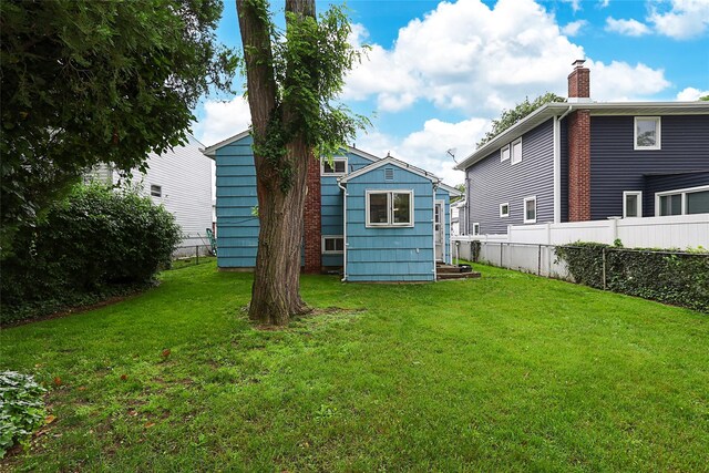 6 Pequot Ave, Port Washington, NY 11050 - rear view of house with a chimney