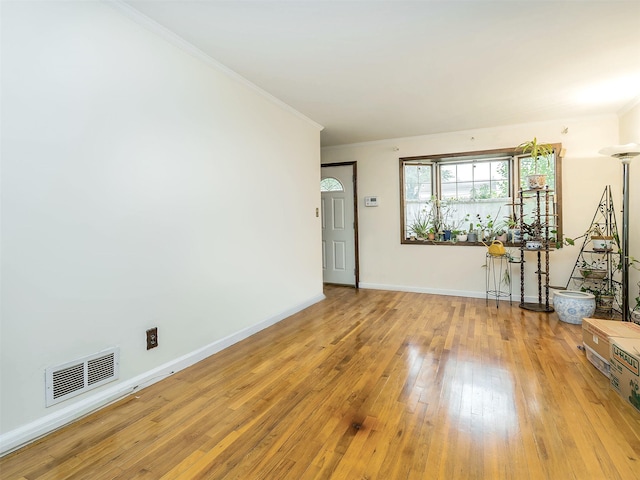 2195 3rd St, East Meadow, NY 11554 - empty room with wood-type flooring and crown molding