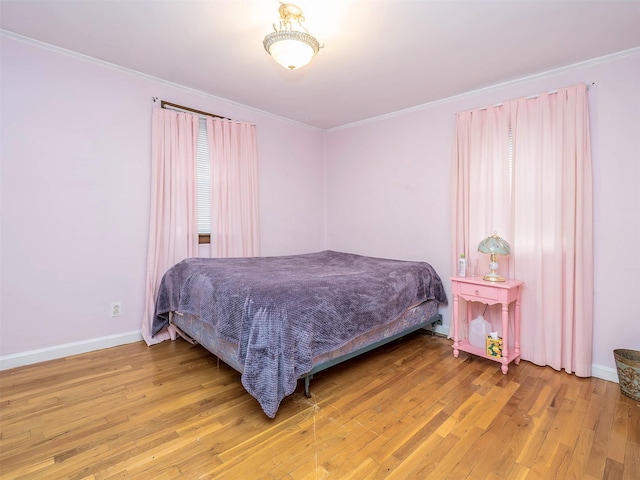 2195 3rd St, East Meadow, NY 11554 - bedroom featuring wood finished floors and ornamental molding